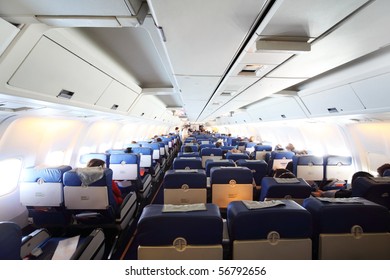 Airplane Cabin With Passengers General View