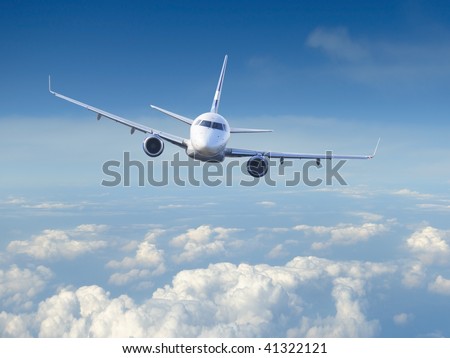 Airplane in the cloudy sky