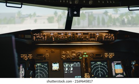 Airplane Cockpit Windscreen In Navigation Cabin To Fly Aircraft, Power Switch With Engine Lever Handle And Radar Compass. Plane Dashboard With Control Panel And Buttons. Close Up.