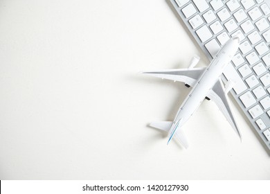 Airplane with computer keyboard. Booking Online