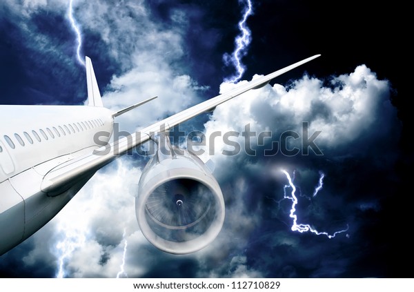 airplane\
crash in a storm with lightning concept. accident airplane in the\
sky. emergency landing. flights in bad\
weather