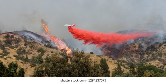 Airplane Drops Fire Retardant On Wildfire