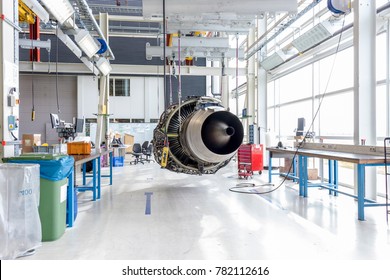 An Airplane Engine During Maintenance In A Warehouse