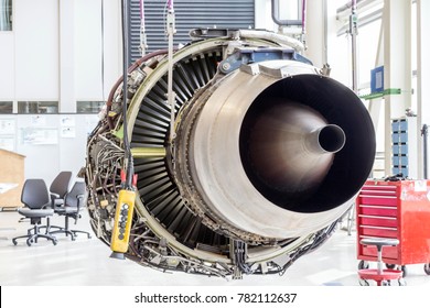 An Airplane Engine During Maintenance In A Warehouse