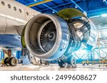 Airplane Engine Jet on The wing During Repair in The Hangar