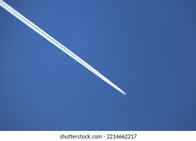 Airplane With Exhaust In A Bright Blue Sky In Rural Manitoba Canada