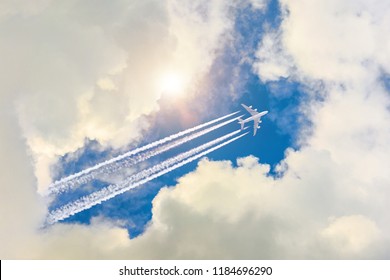 Airplane flies high in the sky, a journey through the clouds and a sunny glare