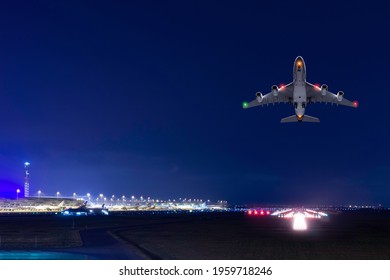 Airplane Fly Up Over Takeoff Runway Of International Airport 