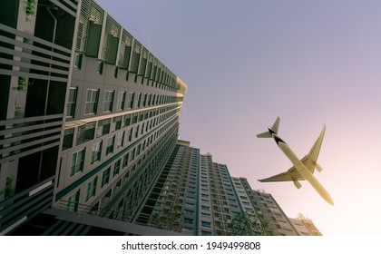 Airplane Flying Above Modern Apartment Building. Exterior Facade Of Skyscraper Building. Business Trip. Transparent Glass Windows Of Apartment. Aviation Business After Coronavirus Vaccine Injection.