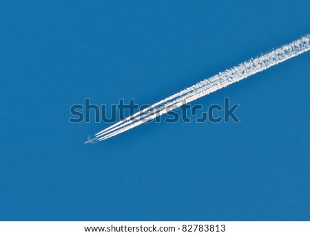 An airplane flying in the blue sky