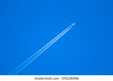 Airplane flying in clear blue sunny weather - Powered by Shutterstock