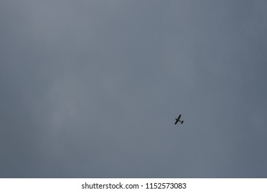 Airplane Is Flying Midair In Cloudy Day/ant View