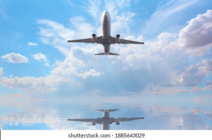 Airplane Flying Over Tropical Sea At Beautiful Cloudy Sky