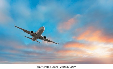 Airplane flying over tropical sea at sunset - Powered by Shutterstock