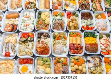 Airplane Food Presentation With Variety Of In Flight Meals.  Flight Catering.  Food On Airplanes. Salad Bar Buffet  Display In Restaurant.  Meat Cuts. Hot Appetizers. Close-up, A Lot Of Food.
