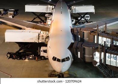 Airplane At Gate During Delivery Catering Service At Night