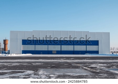 Airplane hangar outside on a clear winter day