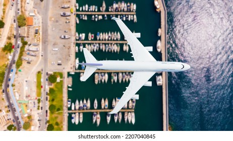 Airplane Landing Above Beautiful Beach And Sea Background