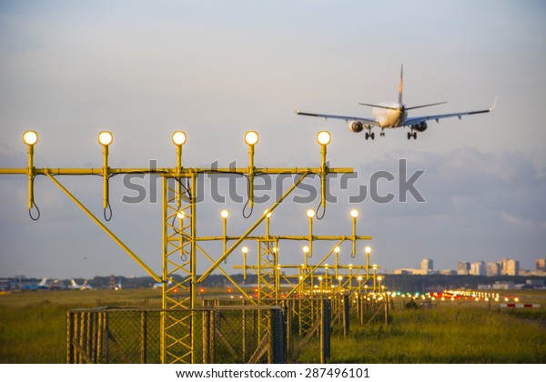 Airplane Landing Behind Runway Lights Stock Photo 287496101 | Shutterstock