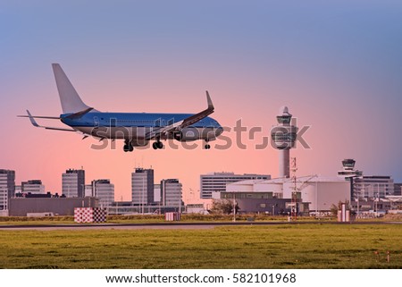 Airplane landing on airport in Amsterdam in the Netherlands