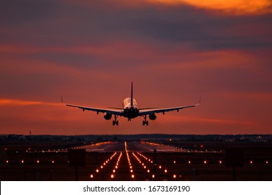 Airplane landing at sunset on otopeni airport