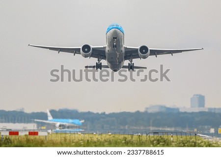 Airplane landing and taking off from Schiphol Amsterdam