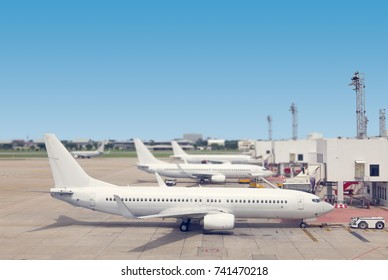 Airplane Loading Passenger At Airport Gate Ramp