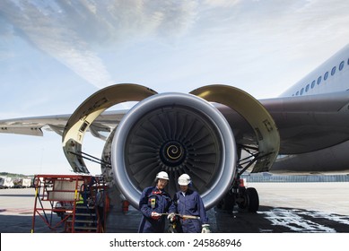 airplane mechanics and giant jet engine repair