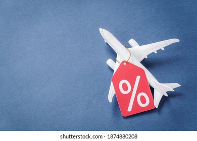 Airplane Model With Percent Symbol Tag With Copy Space. Air Travel Discounts