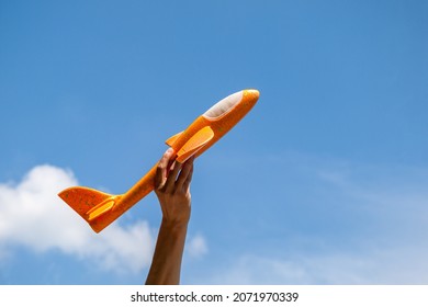 An Airplane On A Background Of Clear Blue Sky, A Symbol Of Ascent And Growth, Success, Upward Movement, Takeoff, Plane