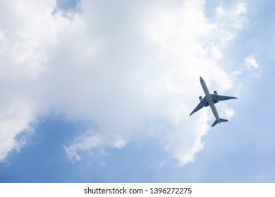 Airplane on blue sky and clouds