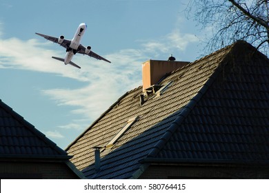 Airplane on departure over a residential area