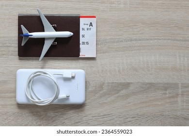 Airplane on passport and power bank for travel of holiday - Shutterstock ID 2364559023