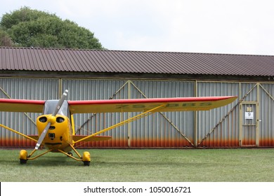 Airplane Outside A Hanger At An Air Field