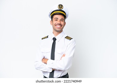 Airplane pilot over isolated white background with arms crossed and looking forward