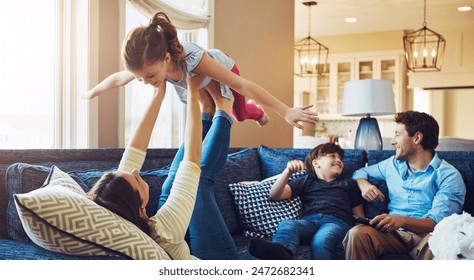 Airplane, playing and family on sofa in home relaxing with care, happiness and love together. Smile, bonding and girl child with flying role play with mom, brother and dad sitting on couch in house. - Powered by Shutterstock