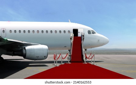 Airplane with red carpet on airport taxiway under bright blue sky - Shutterstock ID 2140162553