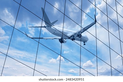 Airplane reflected in skyscraper windows