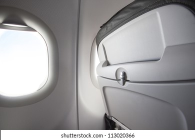 Airplane Seat Back And Sun Shining From Window