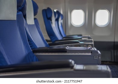 Airplane seat beside window in plane