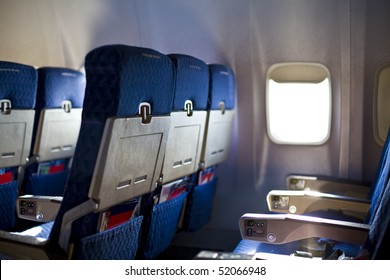 Airplane Seat And Window Inside An Aircraft Focus On First Seat In Row