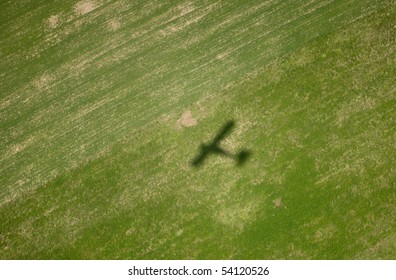 Airplane Shadow On Big Green Field