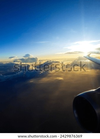 airplane in the sky at sunset