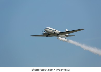 Airplane with smoke.