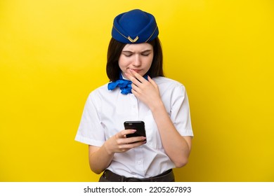 Airplane Stewardess Russian Woman Isolated On Yellow Background Thinking And Sending A Message