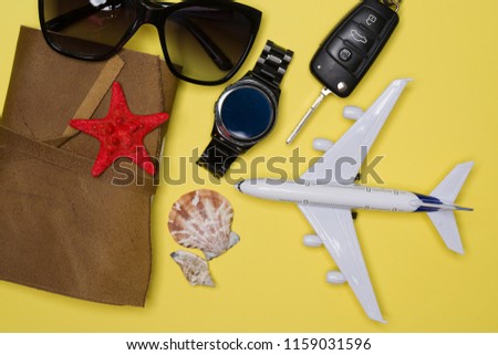 Airplane, sunglasses, watch, car key and agenda. Design concept for travel ideas