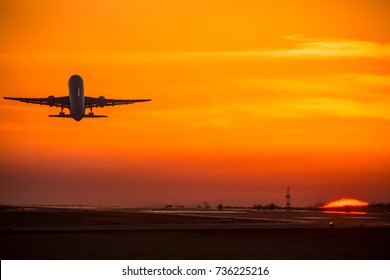 Airplane And Sunset