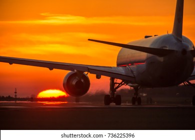 Airplane And Sunset