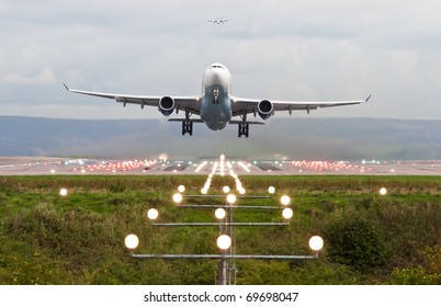 Airplane Take Off At Manchester Airport, England, Uk.