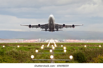 Airplane Take Off At Manchester Airport, England, Uk.